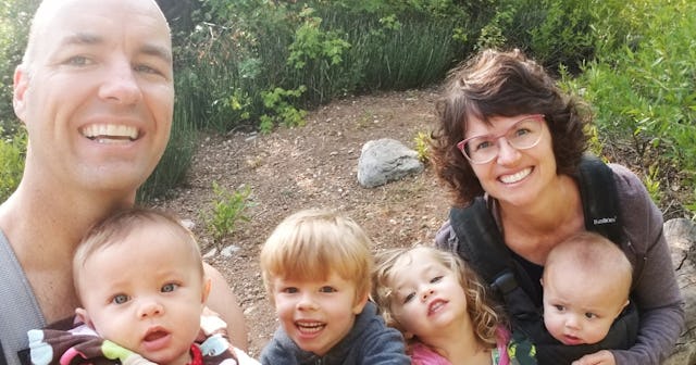 A happy couple with their four kids