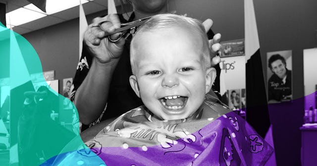 A baby boy being happy at the hairdresser's