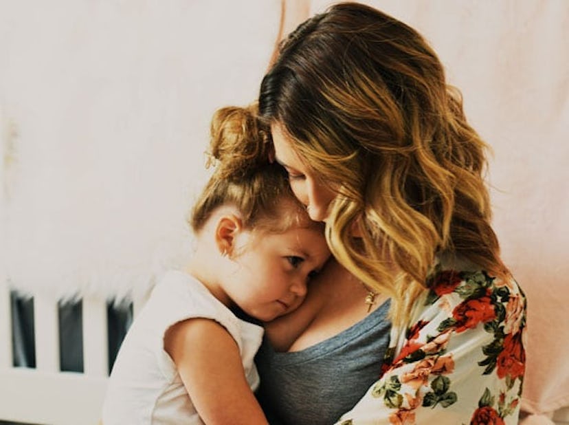Mother hugging her daughter 