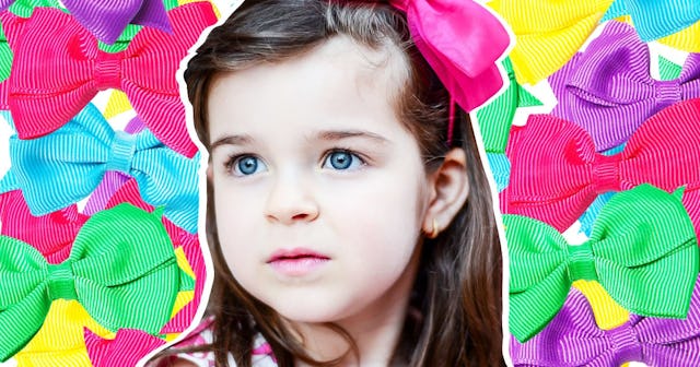 A girl with a pink hair bow with a collage made of multi-colored hair bows