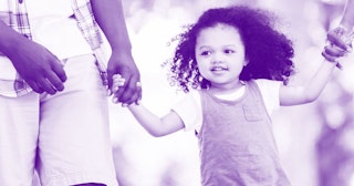 A little girl with autism walking while holding her parent's hands with a purple color filter