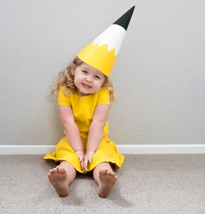A yellow pencil kids costume worn by a baby girl