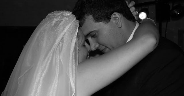 A couple's first dance at their wedding ceremony in black and white
