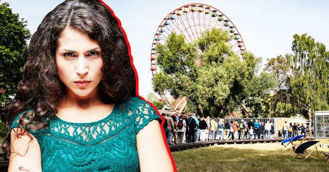 A line at an amusement park with an angry woman crossing her arms in the forefront