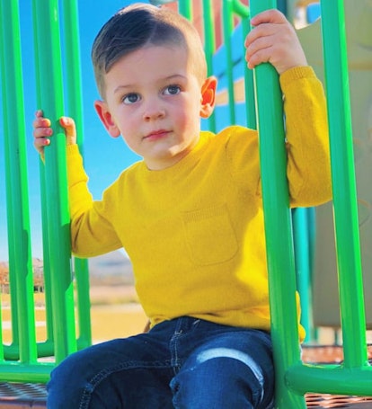 Stephani Hanharan's son in a yellow sweater at a playground