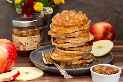 New at Trader Joe's, stack of pancakes beside a fork and some apple slices