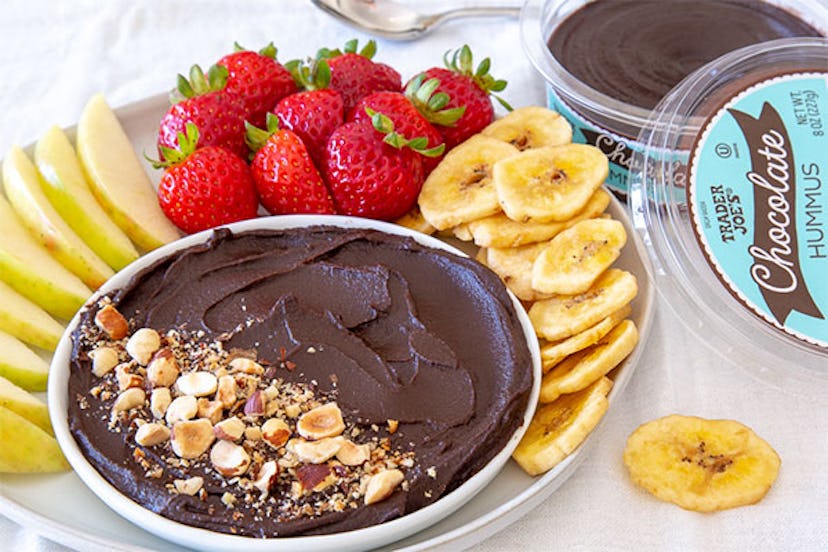 New at Trader Joe's; bowl of chocolate hummus surrounded by apple slices, strawberries and banana ch...