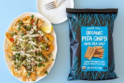 New at Trader Joe's; bowl of topped pita chips beside bag of pita chips