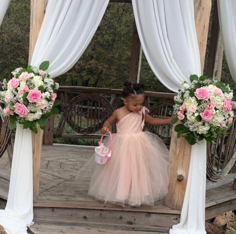 Alexis Olympia Ohanian Jr. walking in a pink tulle dress during flower girl duty