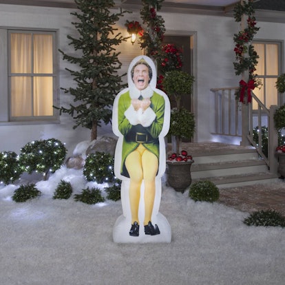 An inflatable and glowing full-sized panel of Will Ferrel as 'Buddy the Elf in a snowy front yard