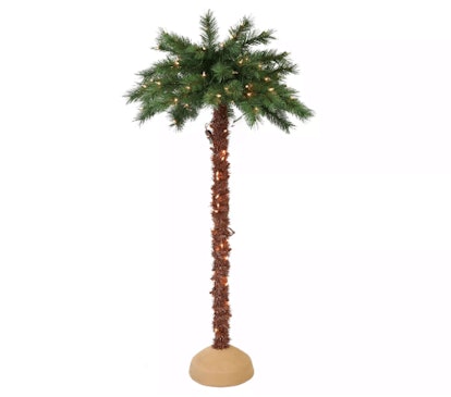 A palm tree made of pine needles with Christmas lights
