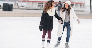 Couple ice skating — winter date ideas
