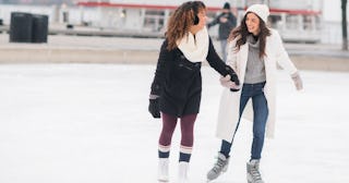 Couple ice skating — winter date ideas