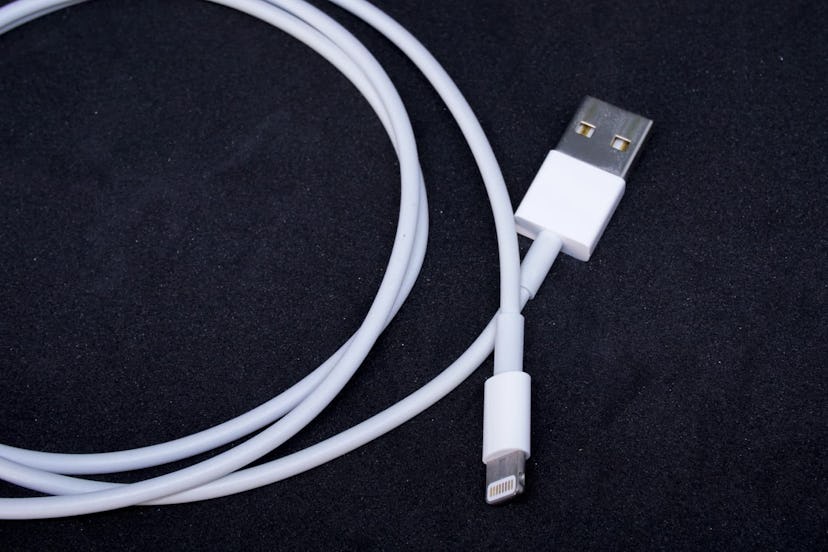 Smartphone USB Charging Lightning Cable on Black Background