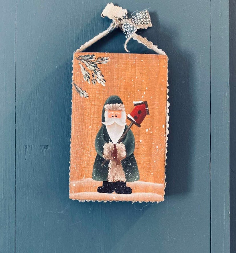 A Christmas decoration with illustrated Santa