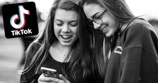 Teenage girls watching TikTok videos on the cell phone
