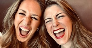 Ashley Kahn Salley and her mom friend taking a selfie while smiling at the top of their lungs.