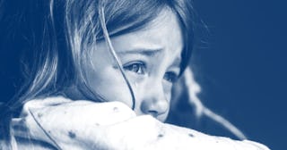 A tween girl crying after being hospitalized for mental health treatment