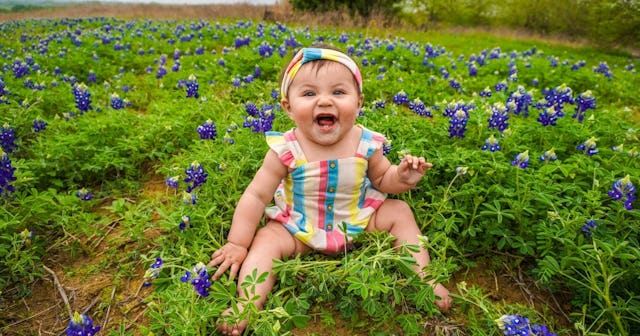 funny baby quotes, baby laughing in a field