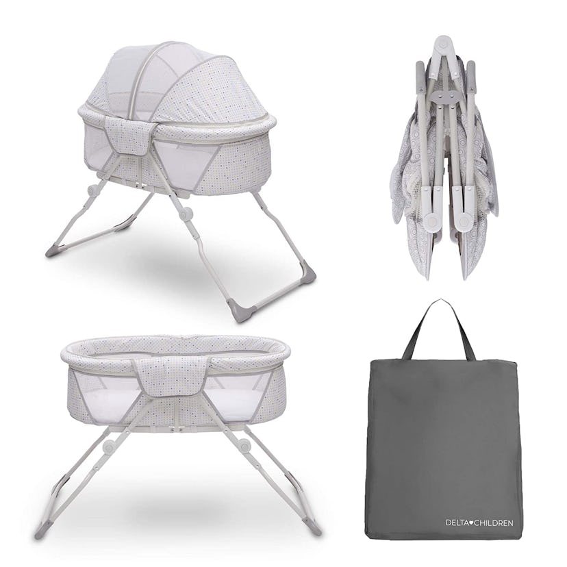 Delta Children EZ Folding Portable Bassinet with Canopy