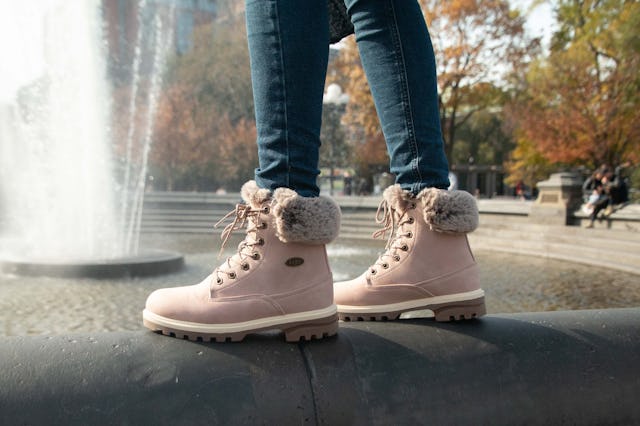 Pink Lugz Boots near water fountain