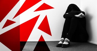 A woman curled up in the corner in black and white with red illustrated asymmetric geometrical shape...