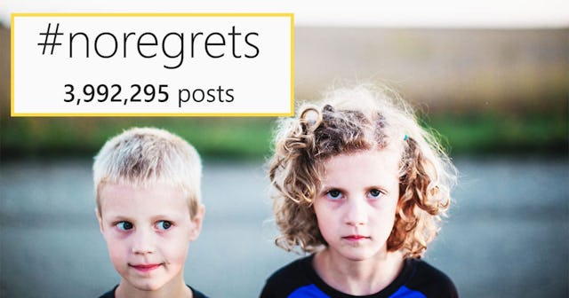 A young boy and a girl with a hashtag no regrets sign above them