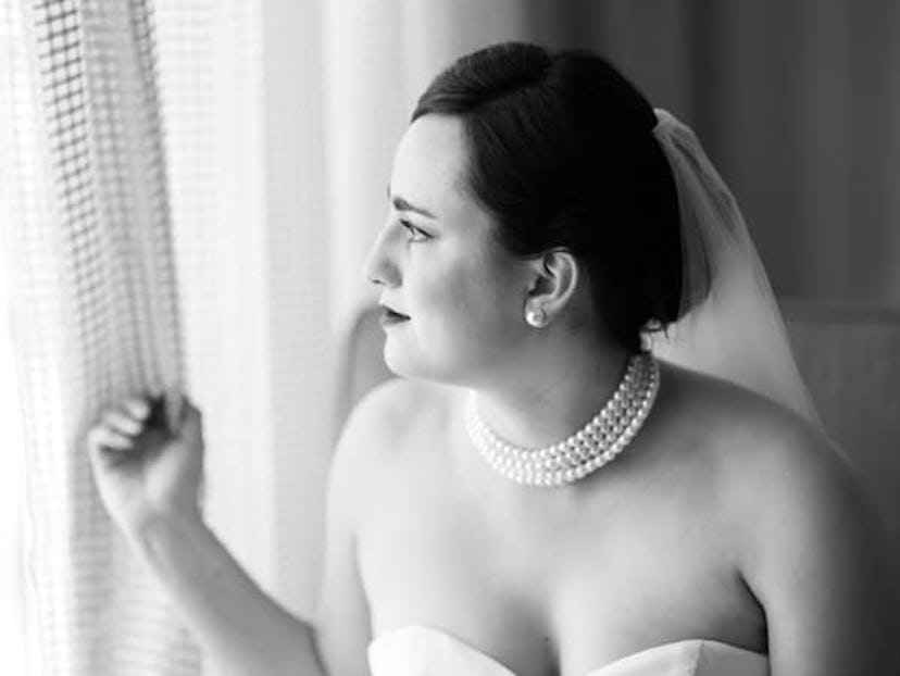 Woman in a wedding dress looking out the window talking about an open letter to her husband about he...