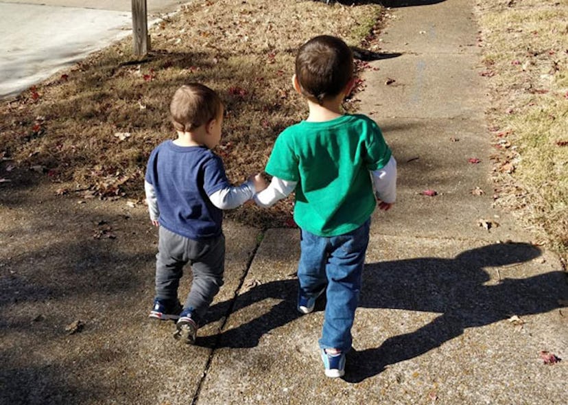 Stephanie Warden's sons walking while holding each other's hands saved their mother's life