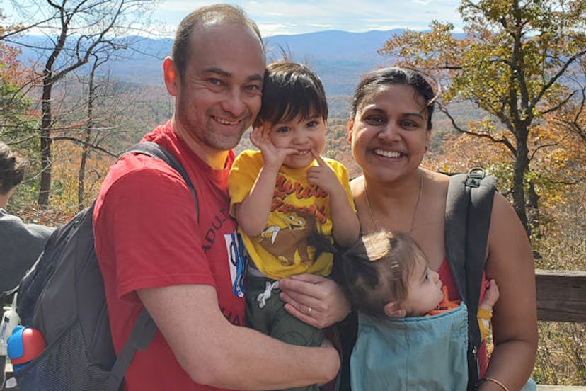 A New Beginning: Mom posing with two children and husband