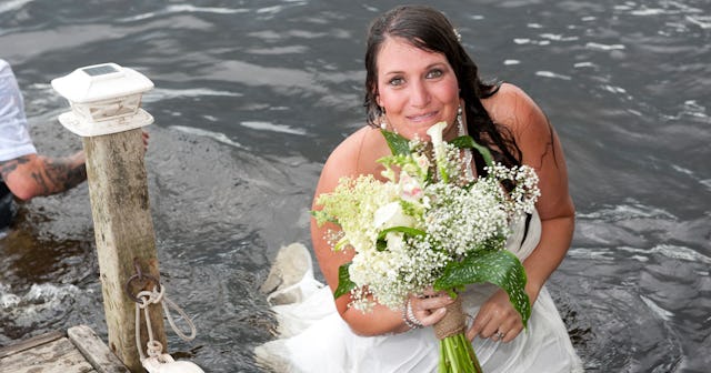 What Falling in a River on my Wedding Day Taught me About Motherhood: wet bride in river holding flo...