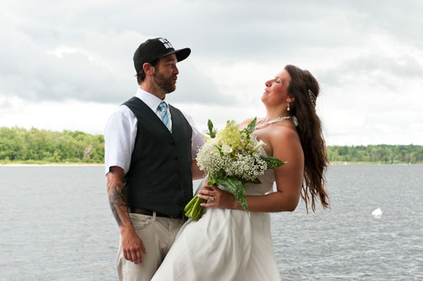 What Falling in a River on my Wedding Day Taught me About Motherhood: Groom dipping bride for photog...