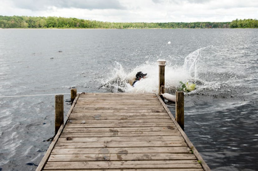 What Falling in a River on my Wedding Day Taught me About Motherhood: Groom dipping bride for photog...