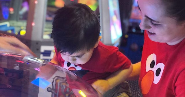 Will This Generation’s Kids Get the Same Attention From Us?: mother and son playing game in arcade