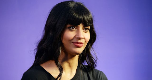 Jameela Jamil coming out: Jameela Jamil smiling off camera on purple background