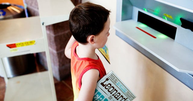 It’s Time To Say Bye-Bye To Library Fines: boys returning books at the public library