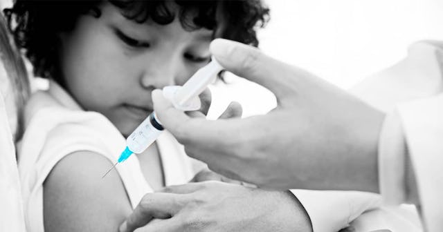 A boy getting vaccinated