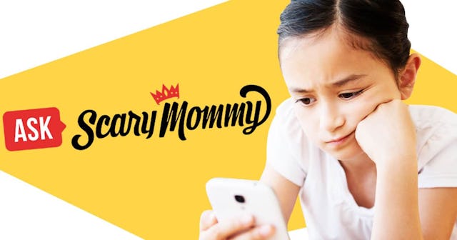 Frustrated girl using cell phone on bed