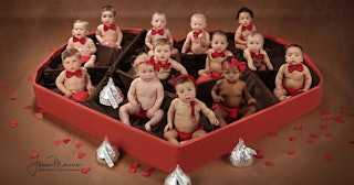 Babies in heart shaped chocolate box