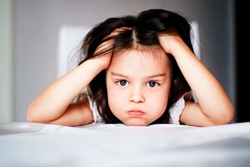 Frustrated girl laying on bed