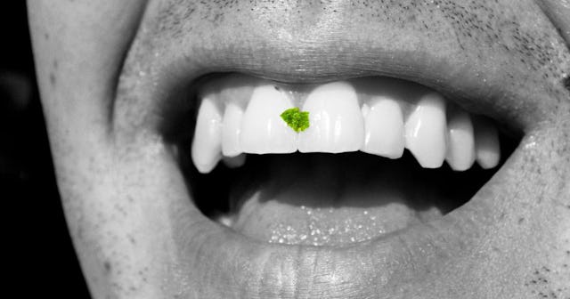 If Someone Has Something In Their Teeth, Tell Them: Man with food in his teeth