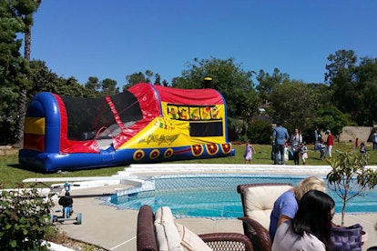 Jumping castle at a birthday party by pool
