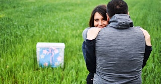 How To Do A Baby Shower With A Sex/Gender Reveal That Doesn’t Suck: couple hugging at gender reveal