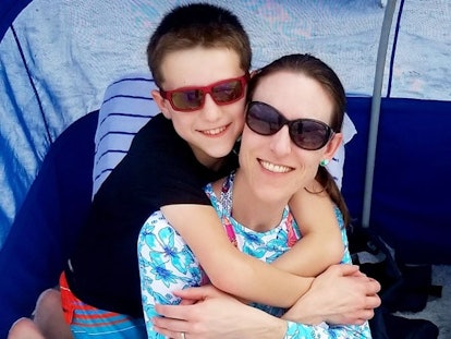 Mom and son posing with sunglasses on