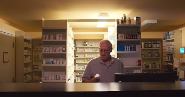 pharmacist behind counter