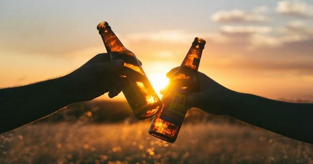 beer quotes, Two people with beer bottles in the sunset
