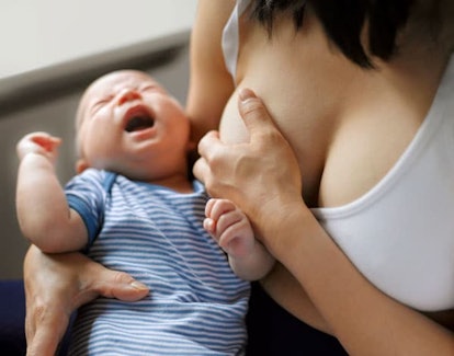 Mother suffering while breastfeeding