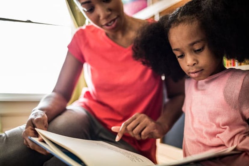 Mother and daughter reading at home