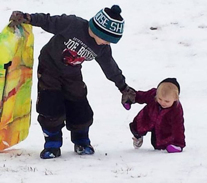 From A Mom Of 9 Kids It's OK To Ignore Me: two kids playing in snow