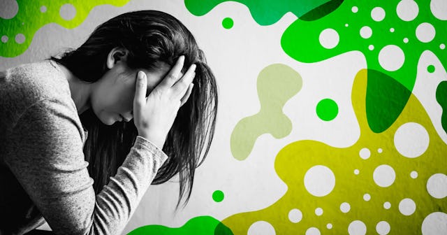 woman sitting on a chair in dark room at home